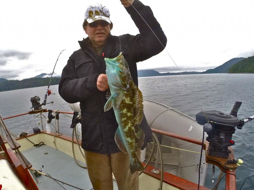 fisherman with lingcod