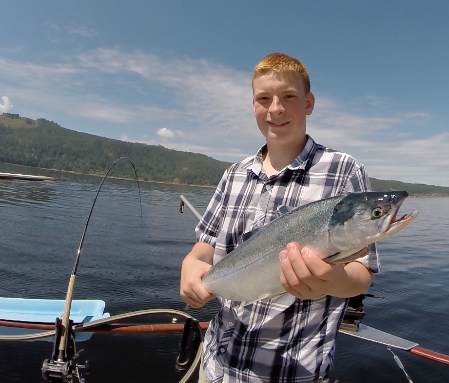 boy with sockeye on BC fishing charter